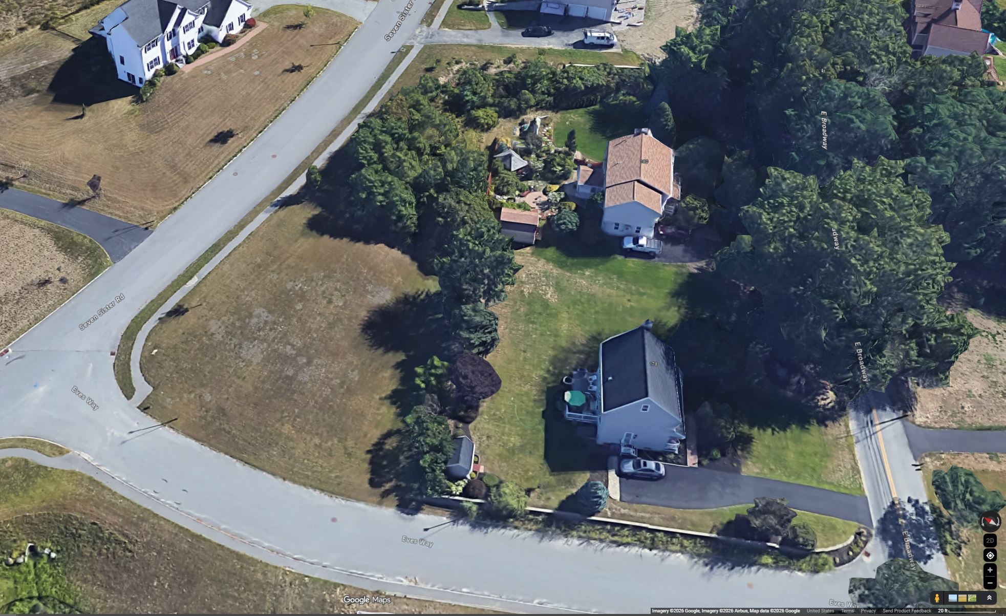 Aerial view showing parcel context and neighboring properties